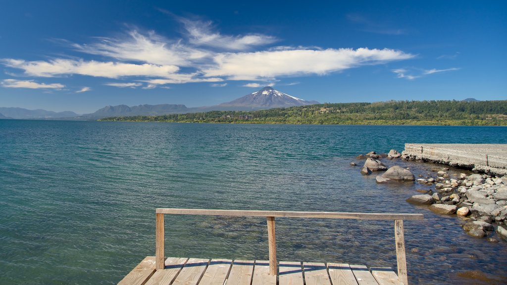 Lake Villarrica featuring mountains and a lake or waterhole