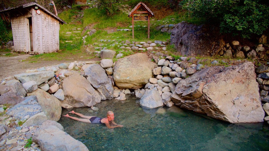 Los Pozones Hot Springs which includes a hot spring and swimming as well as an individual female