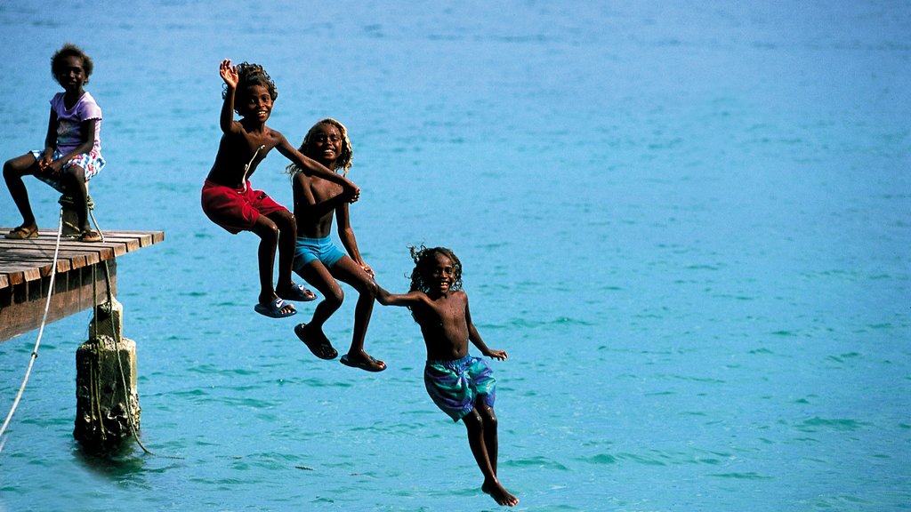 Honiara which includes general coastal views as well as children