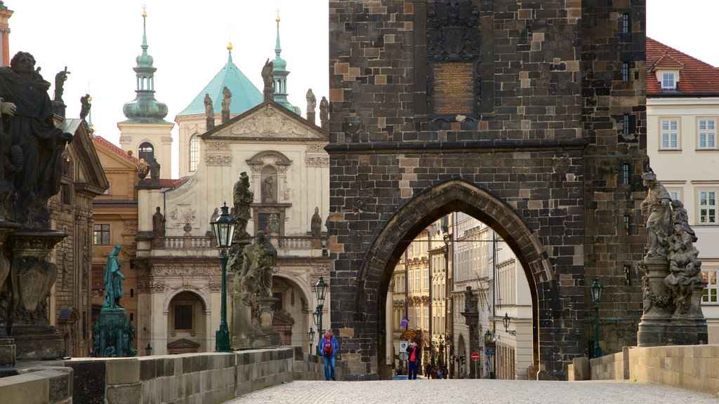 Charles Bridge featuring heritage elements and a city