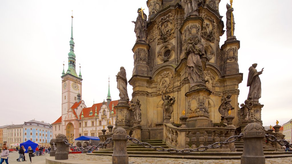 Holy Trinity Column which includes a square or plaza, a statue or sculpture and heritage elements