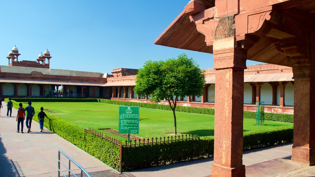 Fatehpur Sikri which includes a garden and a temple or place of worship