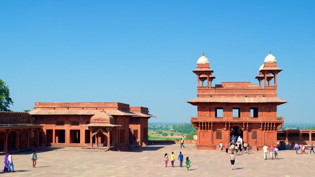 Fatehpur Sikri which includes a temple or place of worship and a square or plaza as well as a large group of people