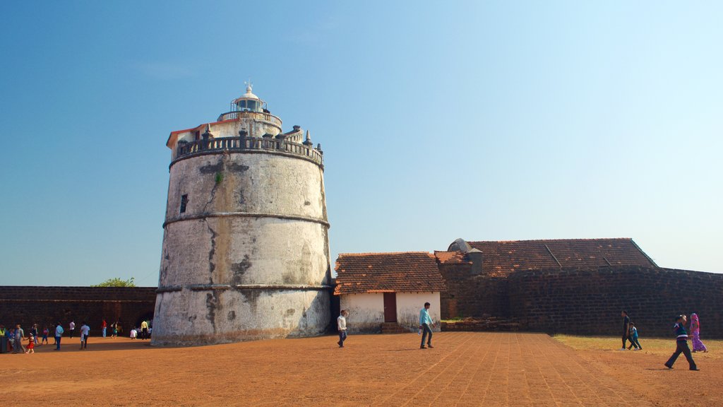 Candolim Beach - Fort Aguada which includes farmland, tranquil scenes and a lighthouse