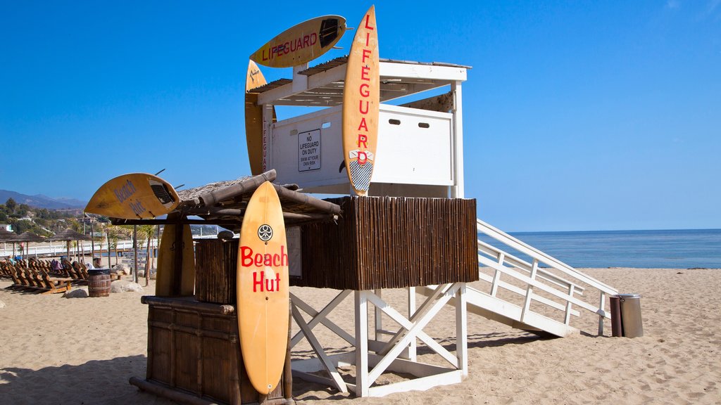 Malibu featuring a sandy beach, signage and general coastal views