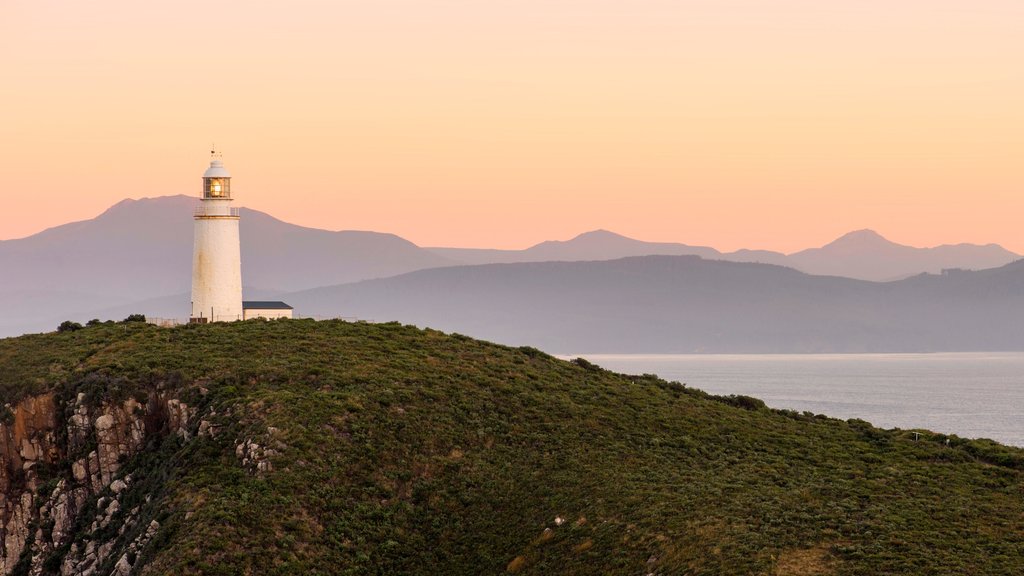 Bruny Island which includes a sunset, general coastal views and a lighthouse