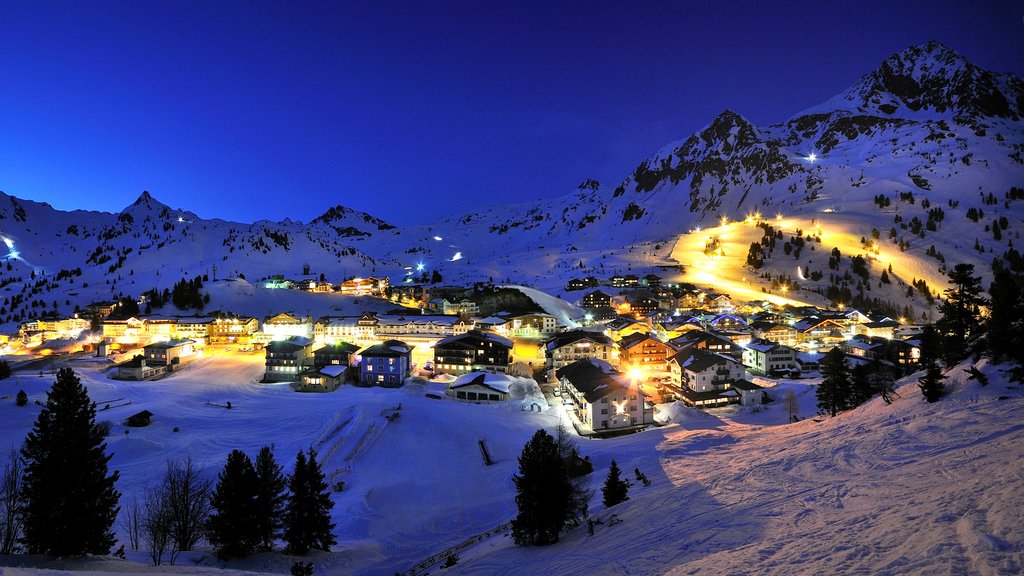 Obertauern which includes snow, night scenes and a small town or village