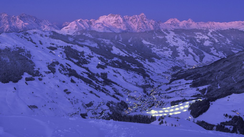 Saalbach-Hinterglemm Ski Resort which includes mountains, snow and a sunset