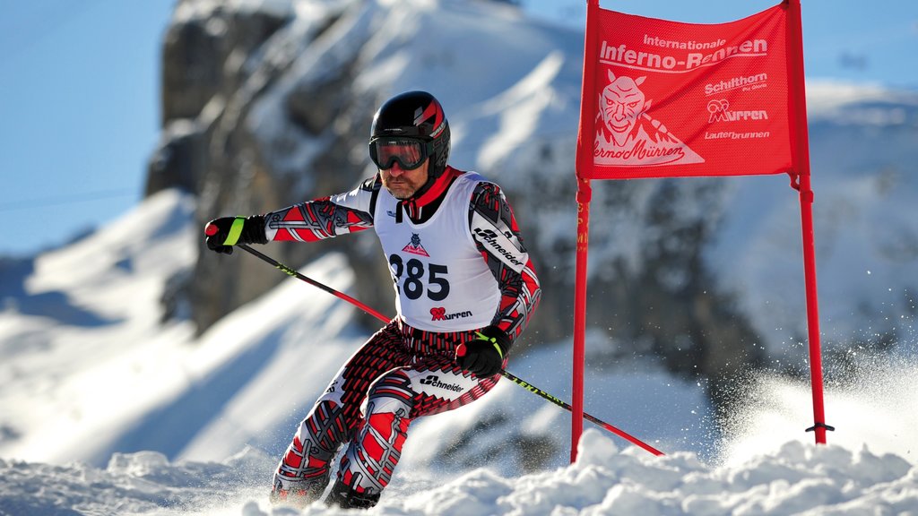 Mürren som inkluderer skikjøring og snø i tillegg til en mann