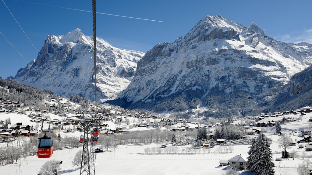 Lauterbrunnen which includes a gondola, snow and a small town or village