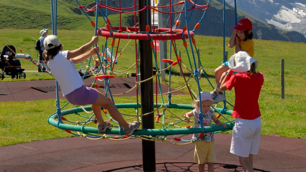 Lauterbrunnen showing a playground as well as a family