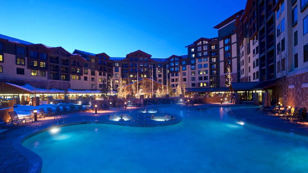 Canyons Resort which includes a hotel, a pool and night scenes