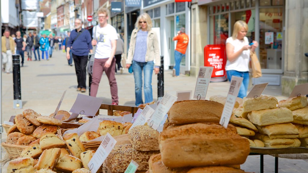 Winchester featuring food as well as a small group of people