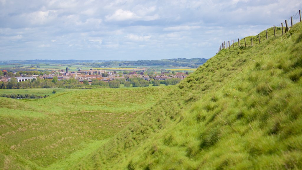 Maiden Castle showing tranquil scenes and a small town or village