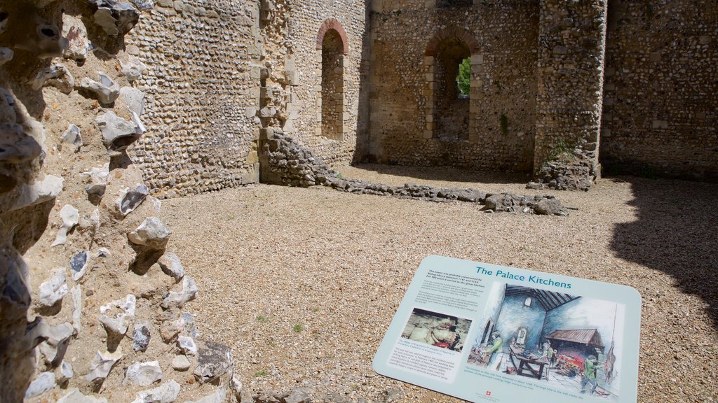 Wolvesey Castle featuring building ruins, chateau or palace and signage