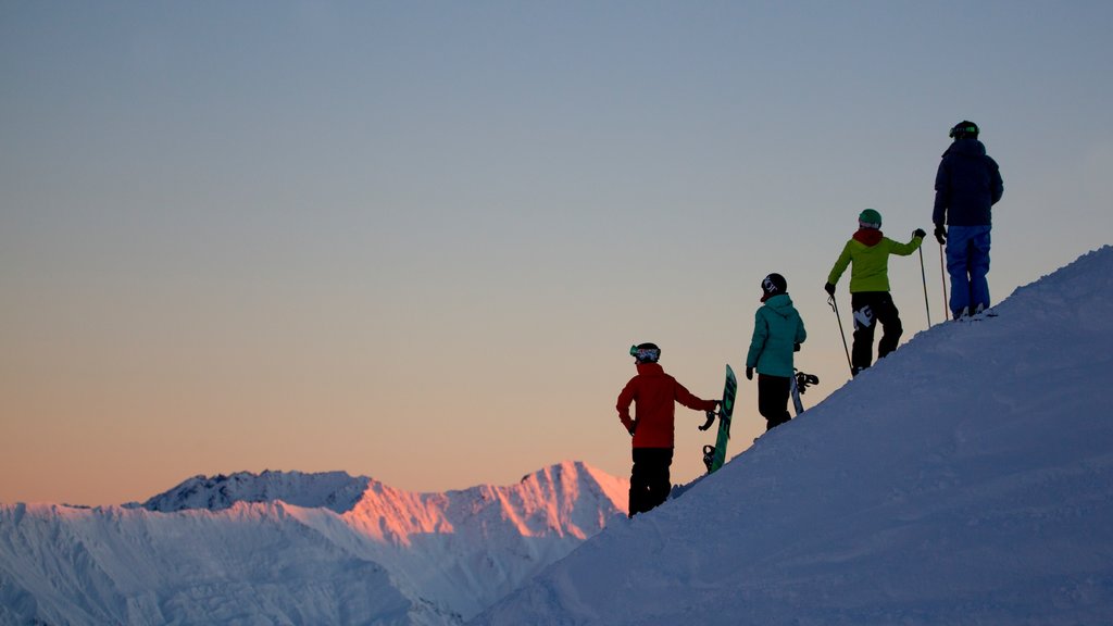 Coronet Peak Ski Area showing snow as well as a small group of people