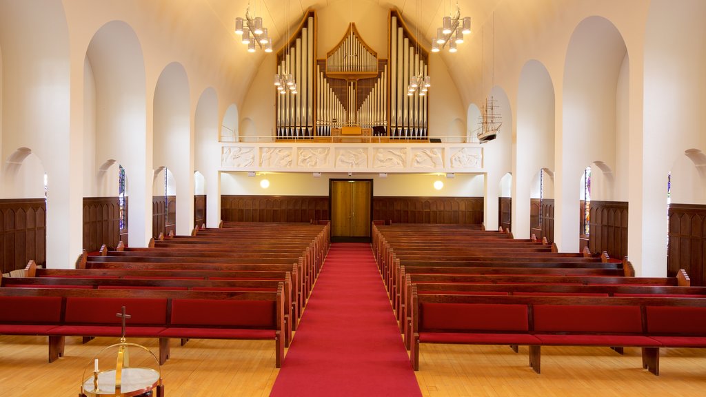 Akureyri Church featuring religious elements, a church or cathedral and interior views