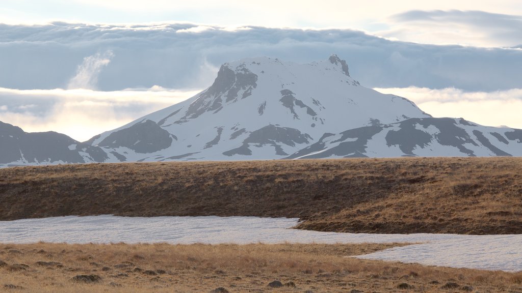 Laugarvatn showing mountains, snow and a river or creek