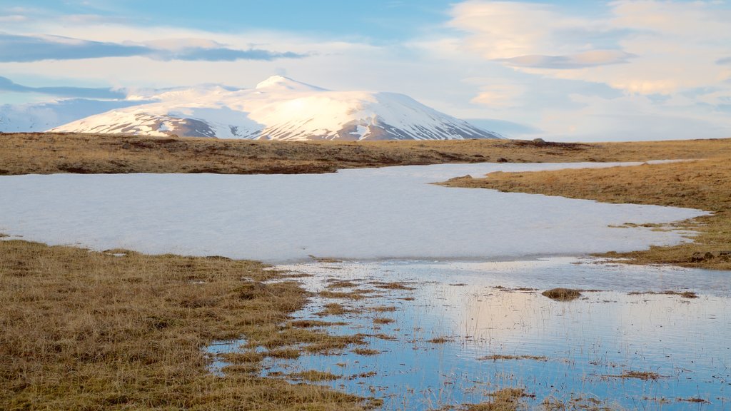 Laugarvatn which includes mountains, a river or creek and snow