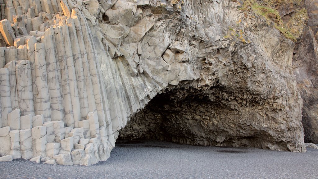 Black Beach which includes caves and general coastal views