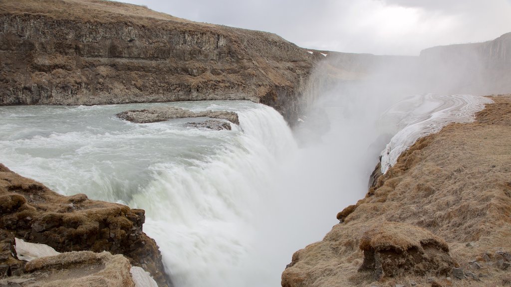 Gullfoss Waterfall which includes mist or fog, a gorge or canyon and a waterfall