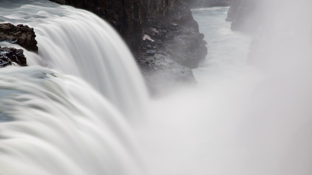 Gullfoss Waterfall showing a cascade and mist or fog