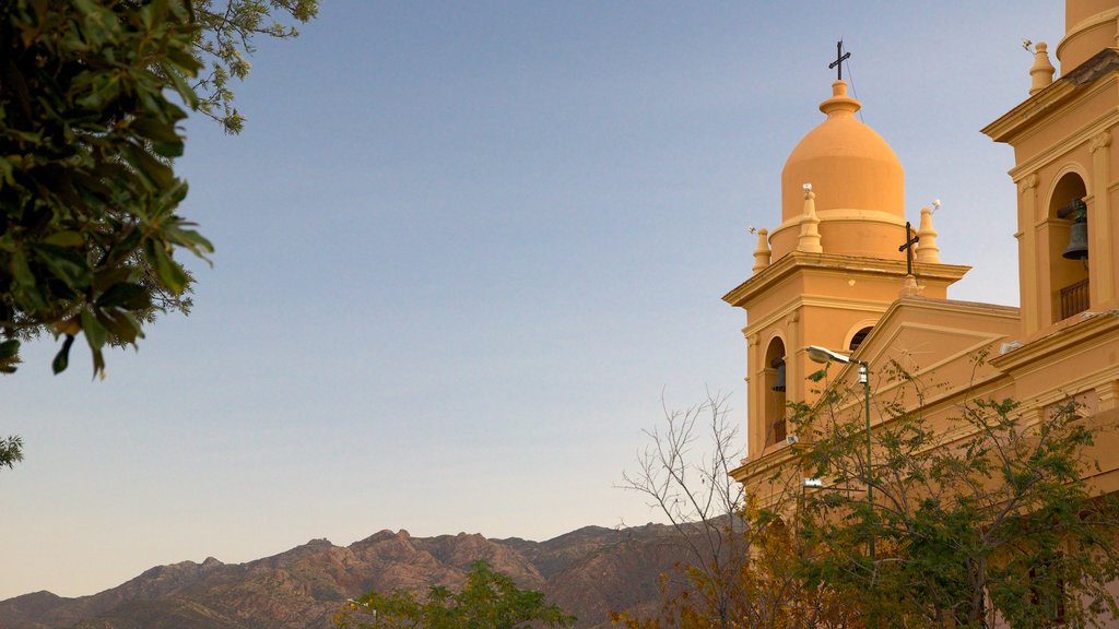 Cafayate which includes a sunset, a church or cathedral and religious aspects