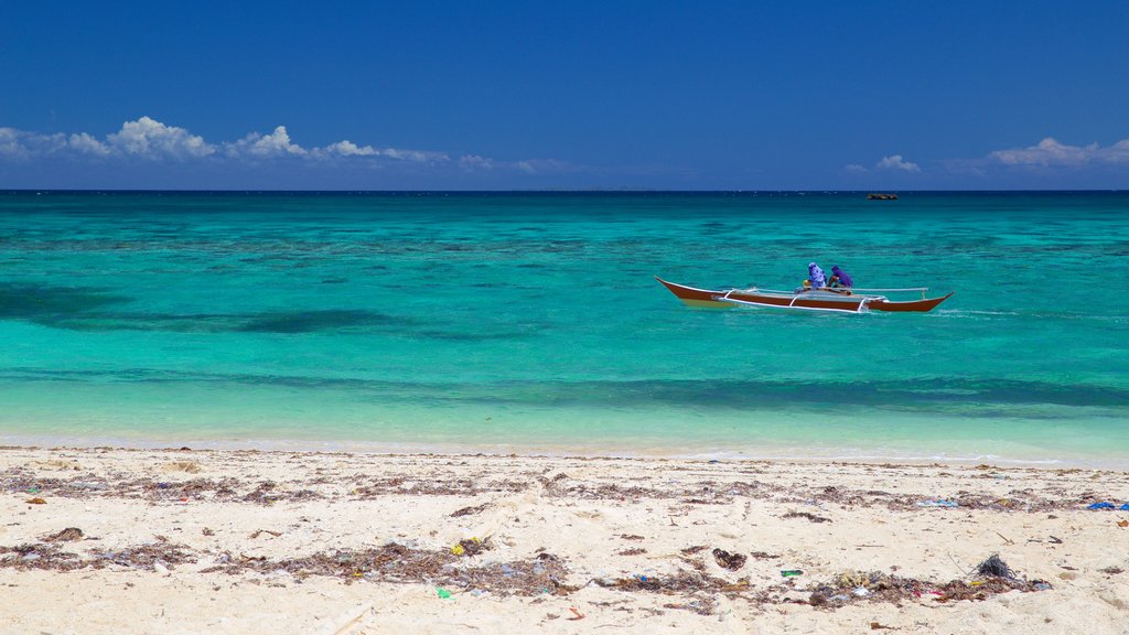 Guimbitayan Beach que inclui uma praia de areia e paisagens litorâneas