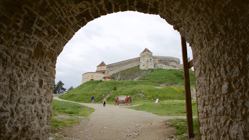 Rasnov Fortress showing building ruins and a castle