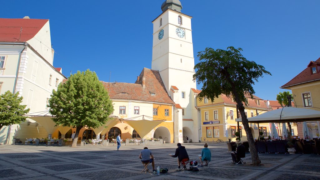 Council Tower which includes a square or plaza as well as a small group of people