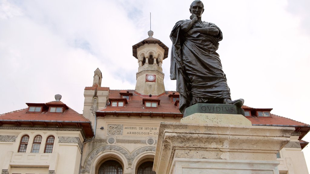 Ovid Square which includes heritage architecture and a statue or sculpture