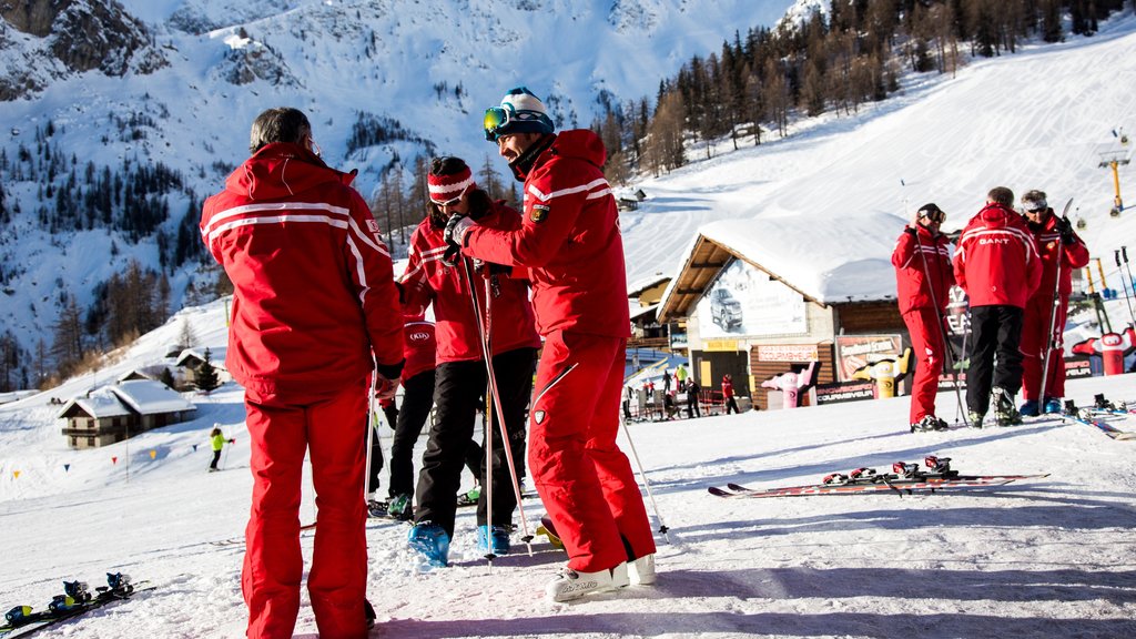 Courmayeur which includes snow and snow skiing as well as a small group of people