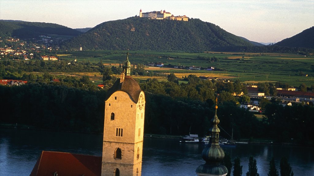 Krems an der Donau which includes landscape views, a sunset and heritage architecture