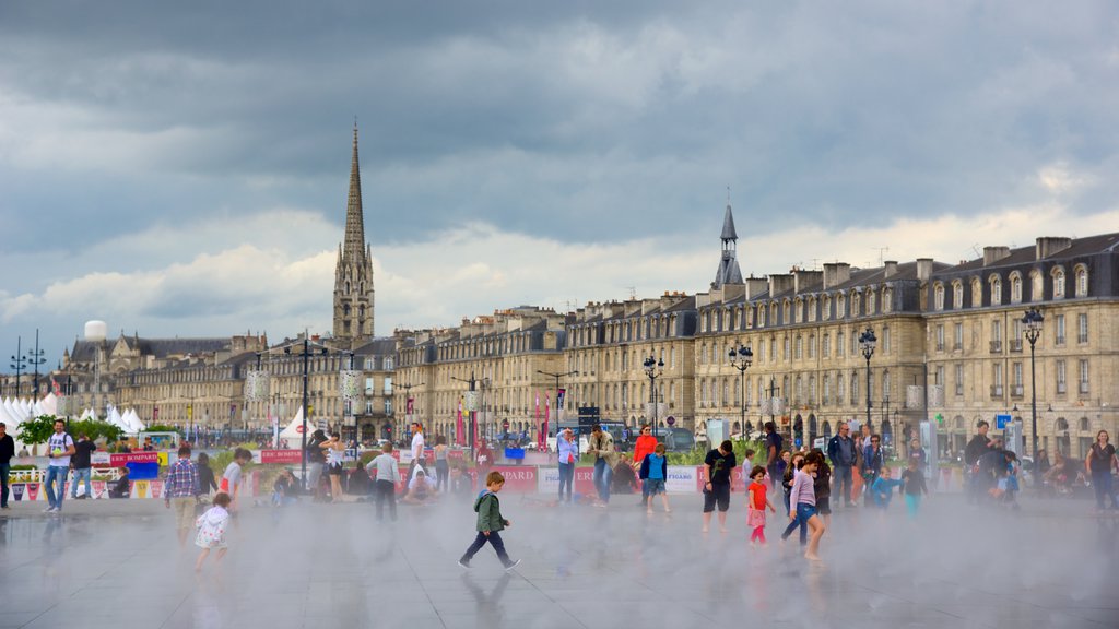 Bordeaux showing mist or fog, a square or plaza and markets