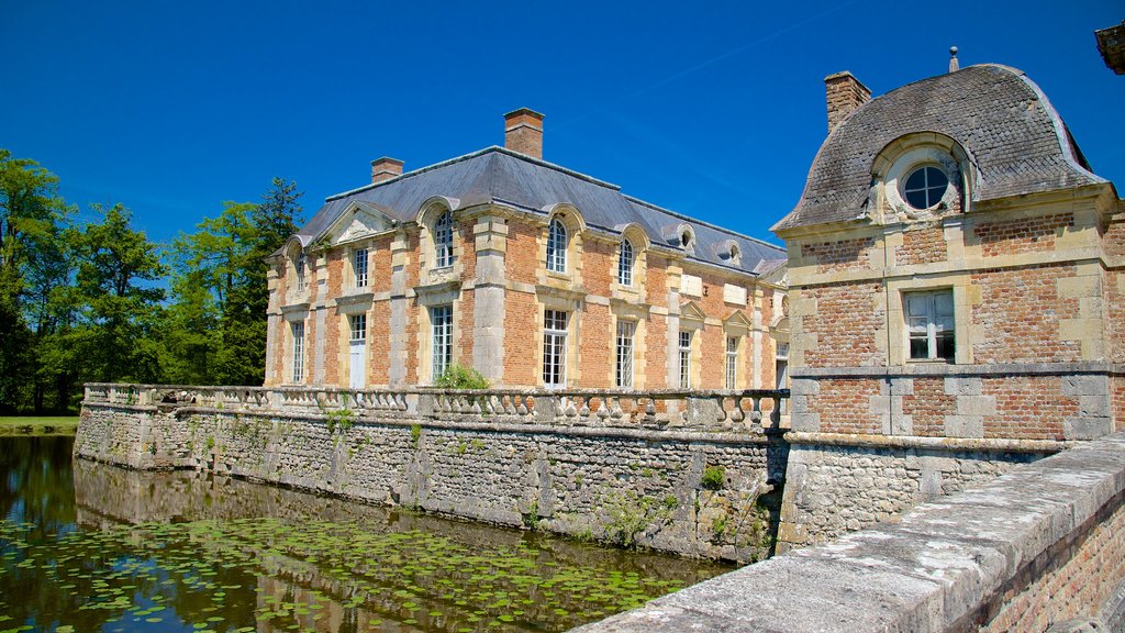 Chateau de la Ferte-St-Aubin which includes a pond and heritage elements