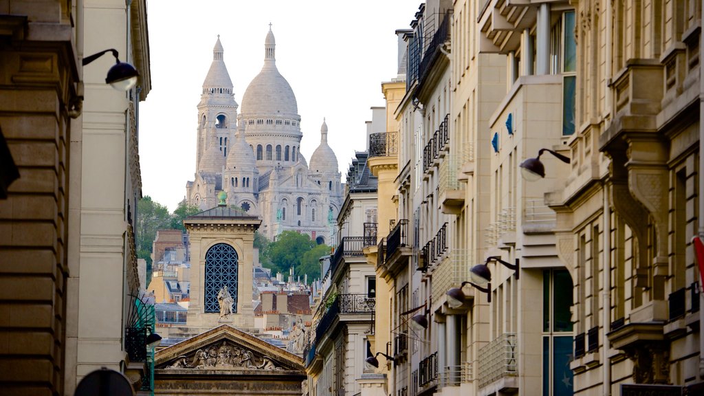 9th Arrondissement showing a church or cathedral, a city and heritage architecture