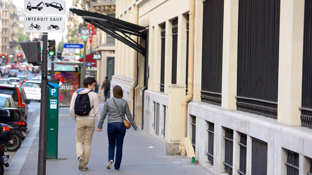 9th Arrondissement showing a city as well as a couple