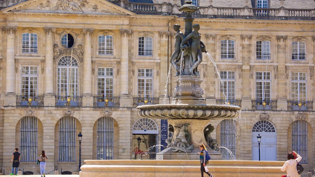 Place de la Bourse featuring a fountain, an administrative buidling and heritage architecture