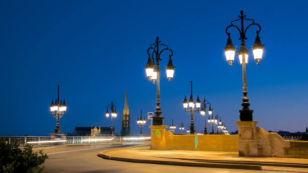 Pont de Pierre which includes a bridge and night scenes