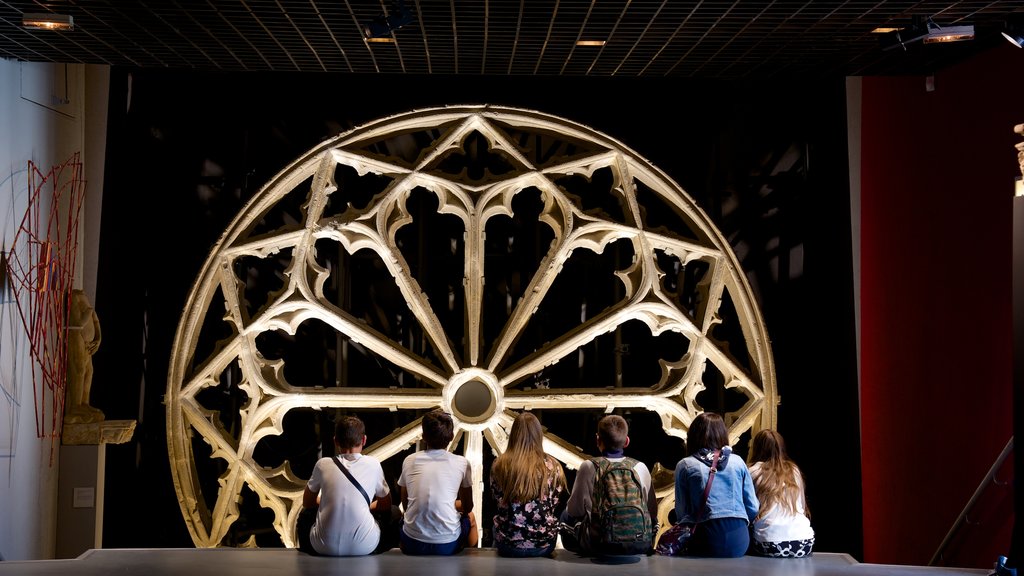 Aquitaine Museum featuring interior views as well as a small group of people