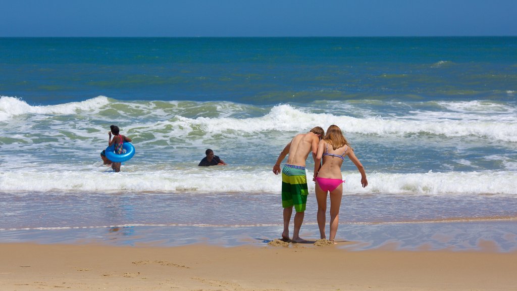 Ocean City Beach showing a sandy beach and surf as well as a couple