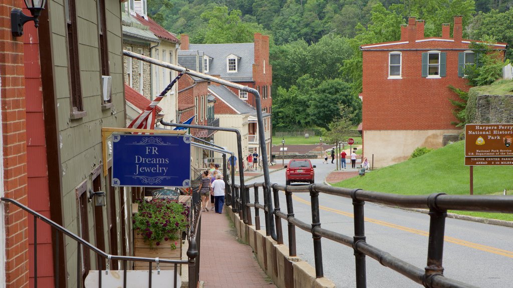 Harpers Ferry National Historical Park featuring a small town or village, street scenes and signage