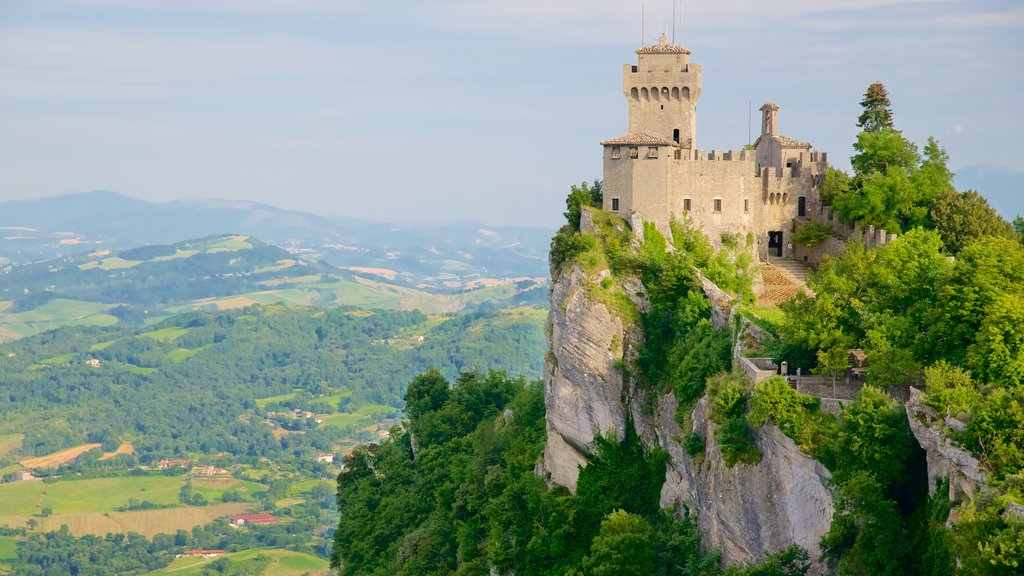 Guaita Tower which includes mountains, a castle and tranquil scenes