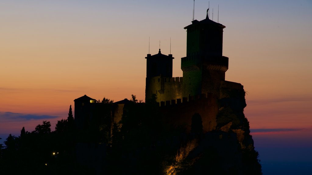 Guaita Tower featuring heritage architecture, chateau or palace and a sunset