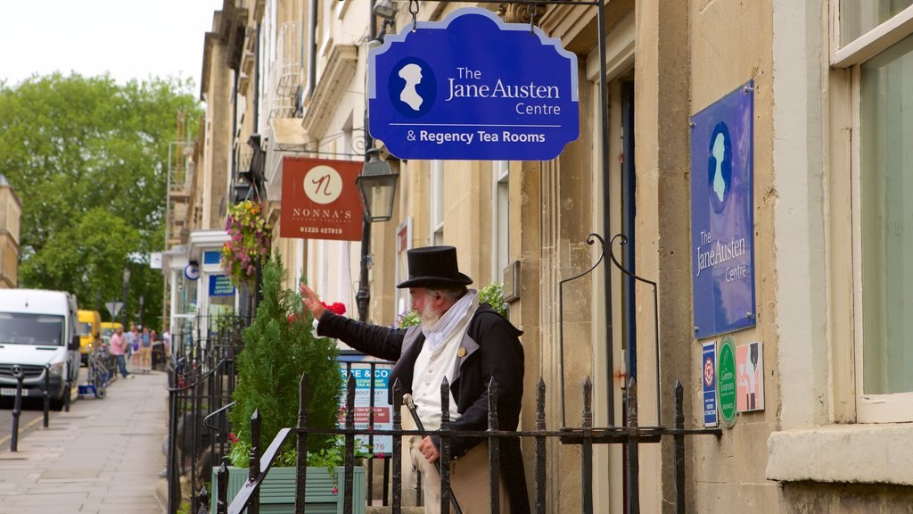 Jane Austen Centre showing signage as well as an individual male