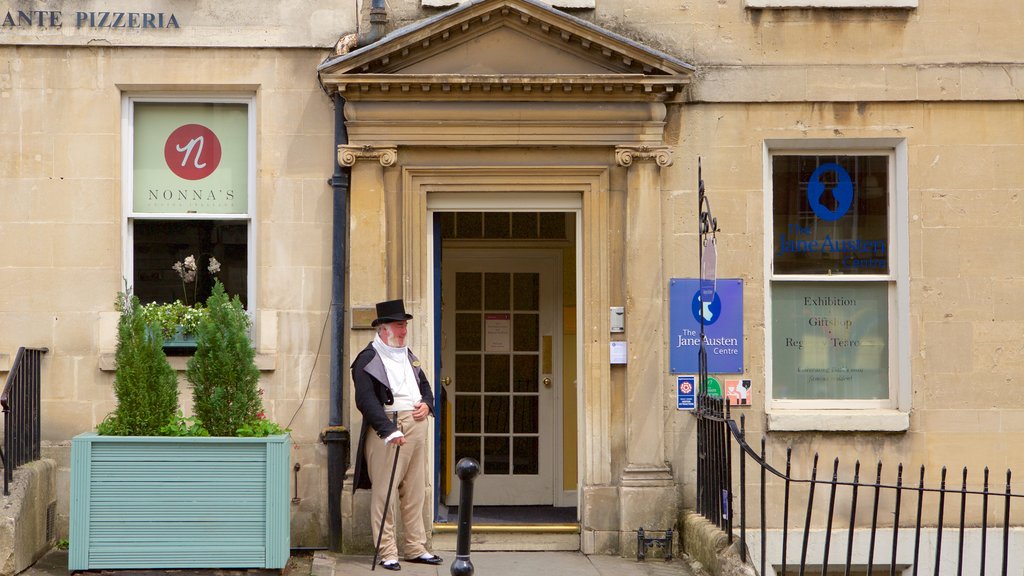 Jane Austen Centre featuring signage as well as an individual male