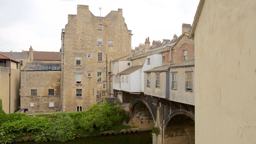 Pulteney Bridge showing heritage architecture, a river or creek and a bridge