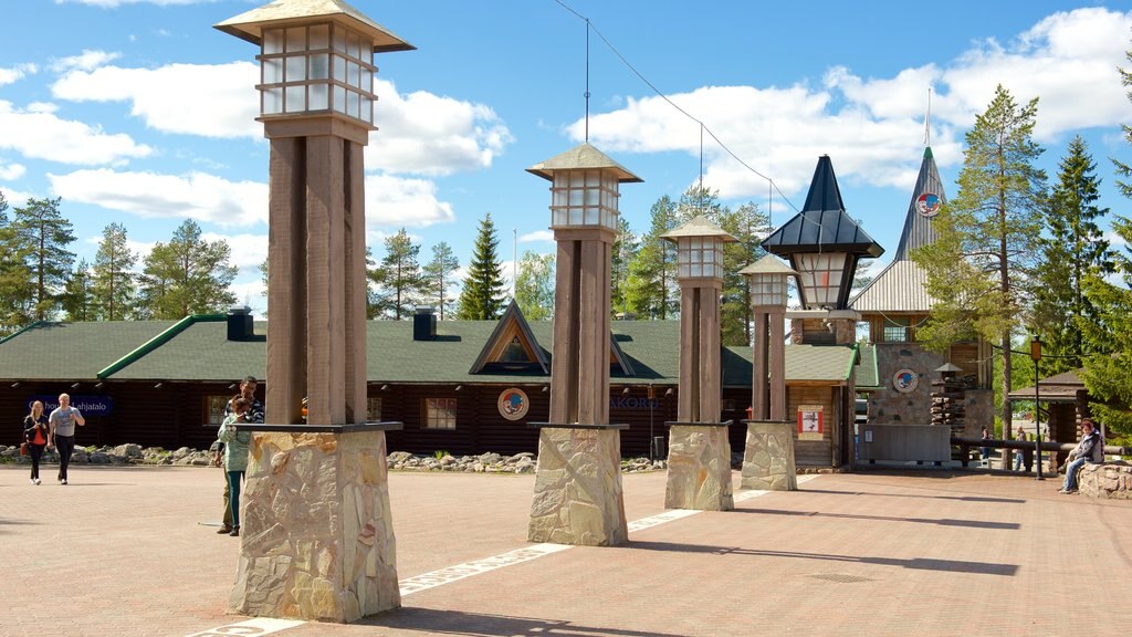 Rovaniemi showing a square or plaza as well as a small group of people