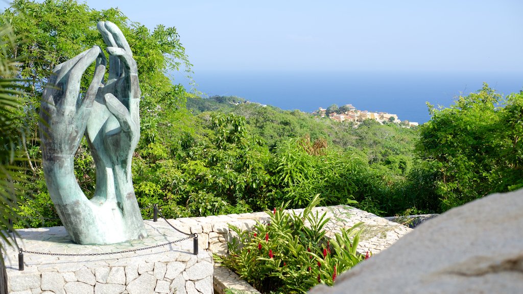 Capilla de la Paz featuring a statue or sculpture, a church or cathedral and general coastal views