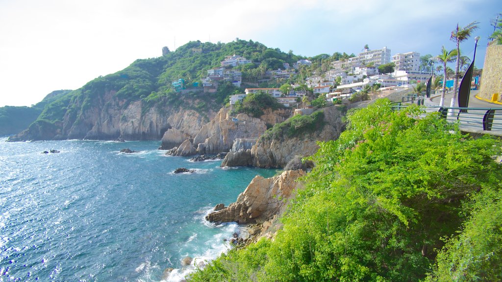 La Quebrada Cliffs showing a gorge or canyon, rocky coastline and a coastal town